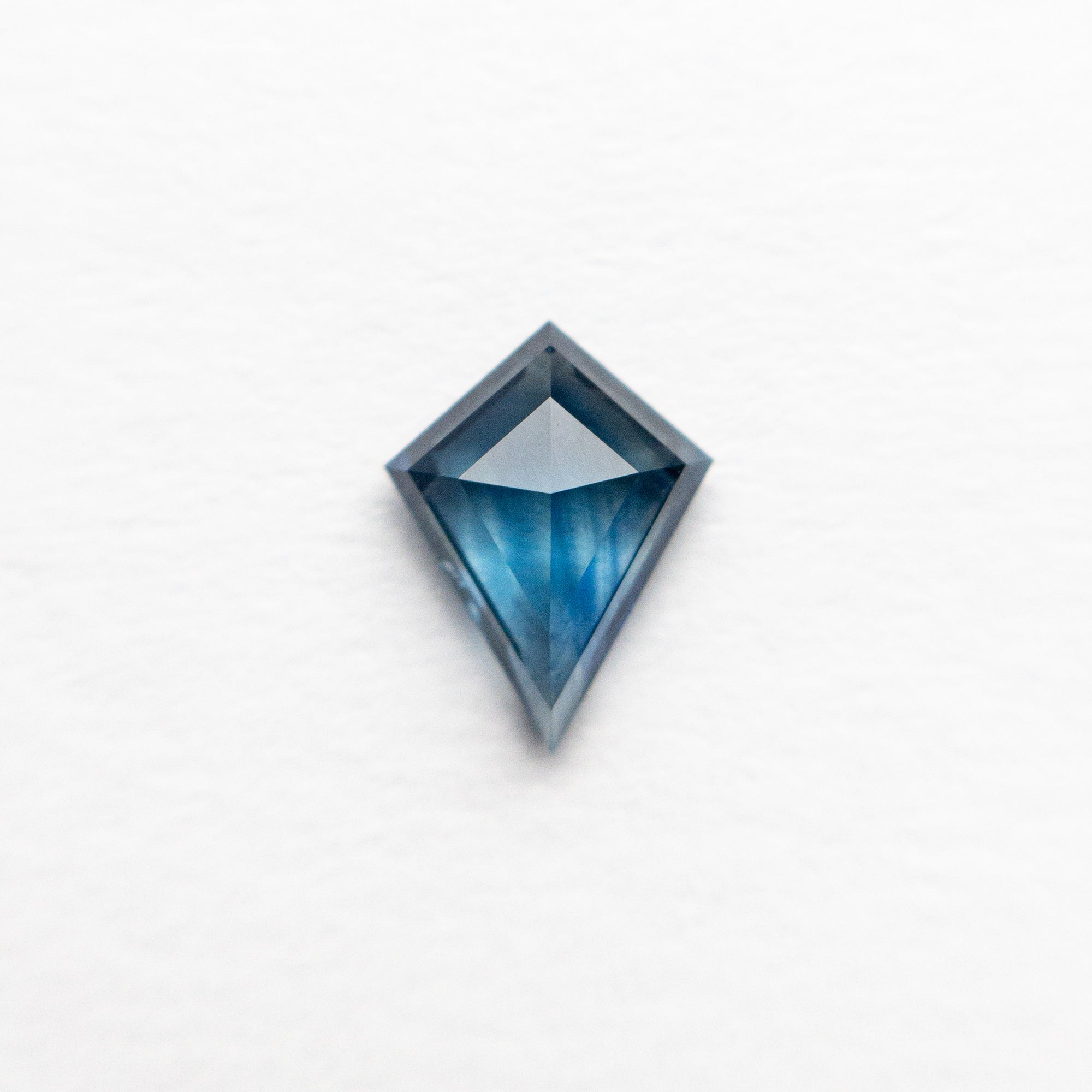 0.65ct 7.33x5.59x2.61mm Kite Step Cut Sapphire 22433-03