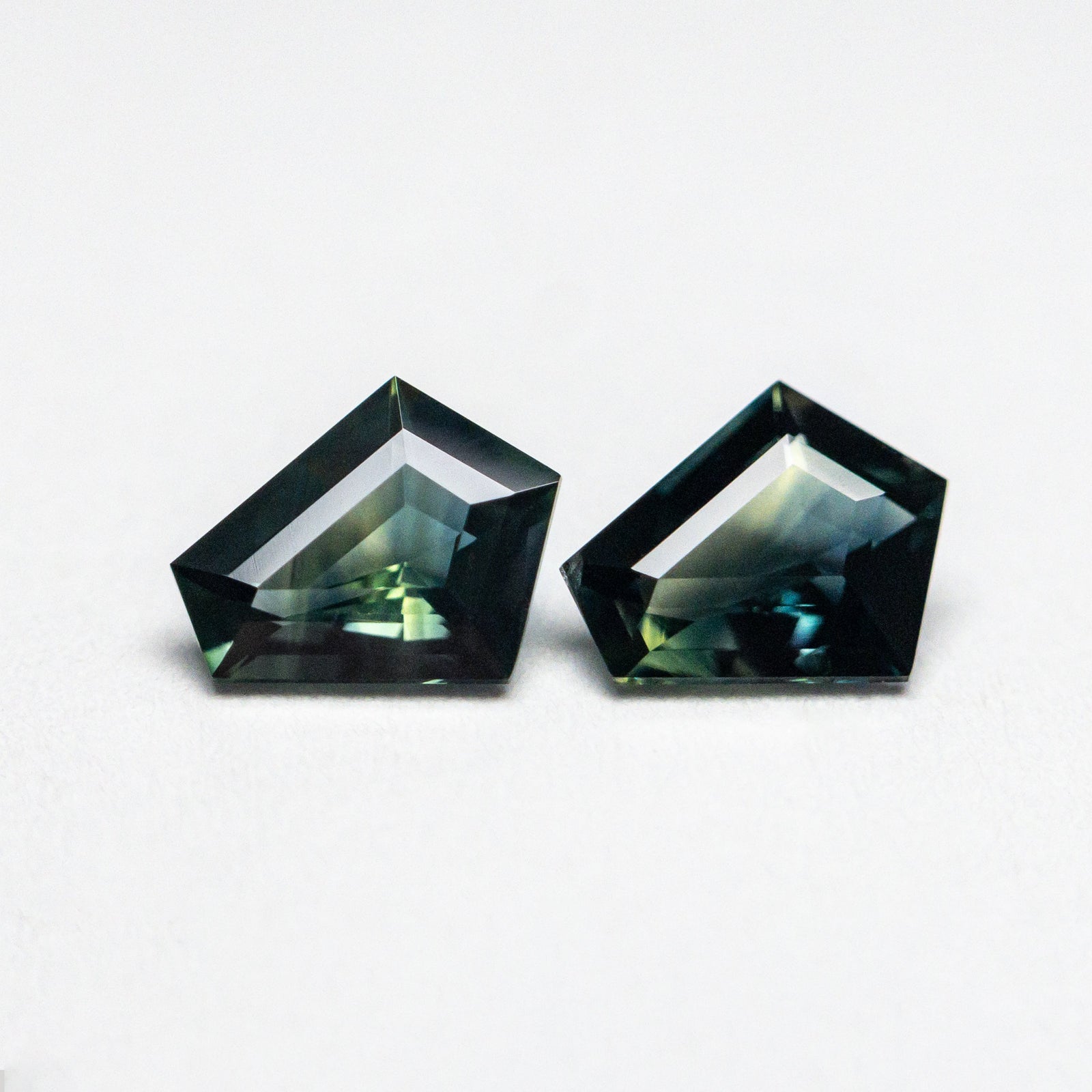 0.74cttw 2pc 5.49x4.57x2.34mm 5.51x4.68x2.13mm Pentagon Step Cut Sapphire Matching Pair 22768-25
