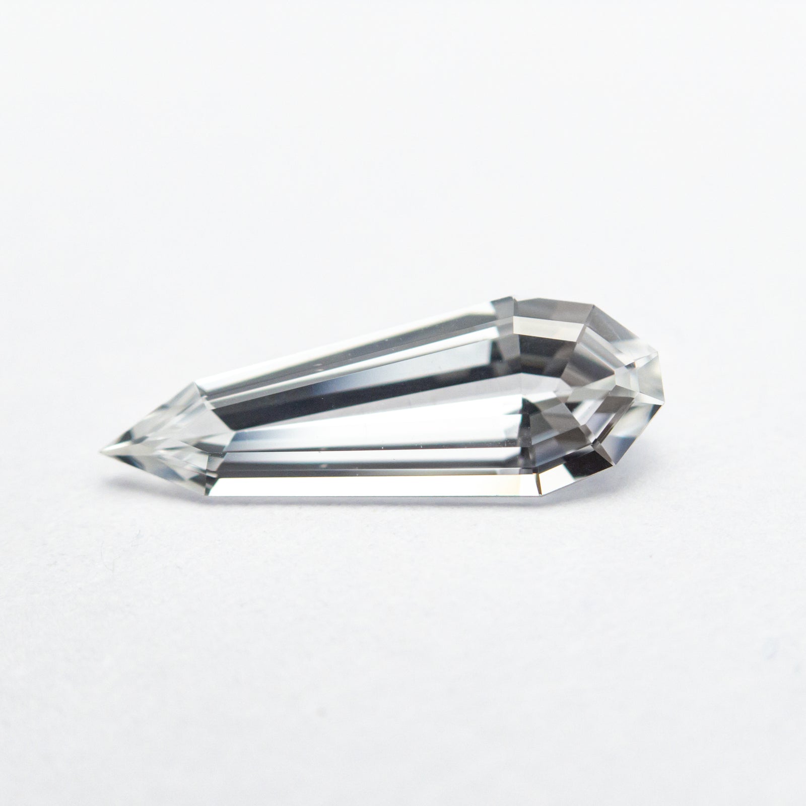0.73ct 11.29x4.08x2.30mm Geo Pear Step Cut Sapphire 22833-01
