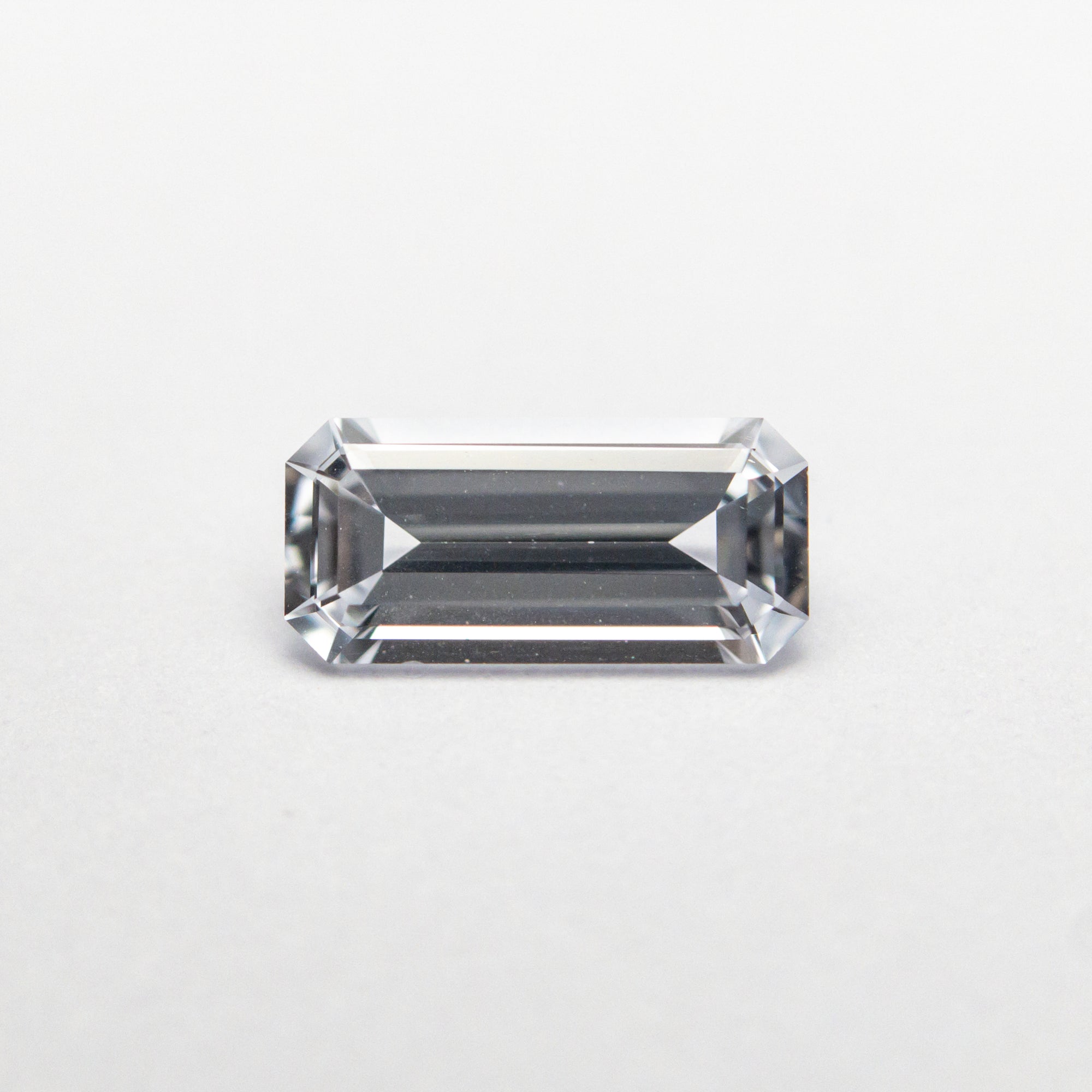 0.65ct 7.47x3.51x2.35mm Cut Corner Rectangle Step Cut Sapphire 22838-01